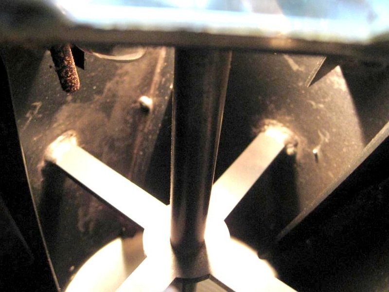 Maggio_16.jpg - The inside of the drum showing the shaft and supports The dirty rod upper left is the thermocouple.